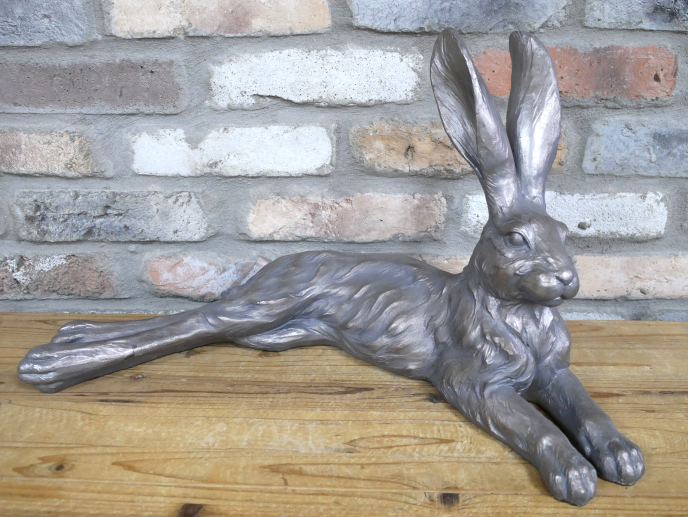 Large laying down hare in grey , indoor or outdoor statue