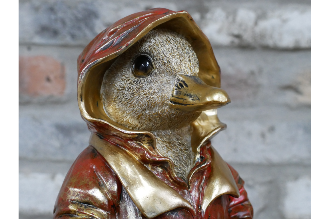 Duck in a red coat statue