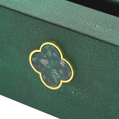 Green tissue box with green clasp detail. Faux leather