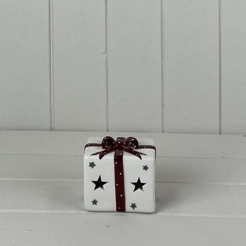 White Ceramic Present With Red Bow Decoration