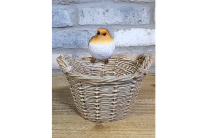 Robin on a basket garden statue
