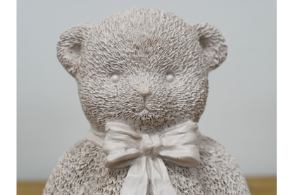 Cream teddy bear statue