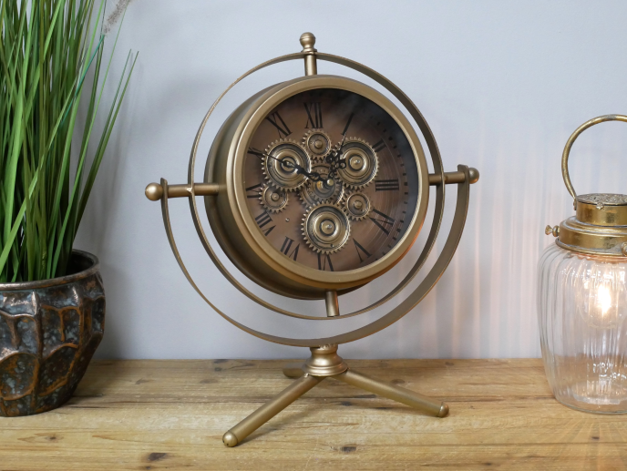 Gold mantle clock tripod legs with moving cog details