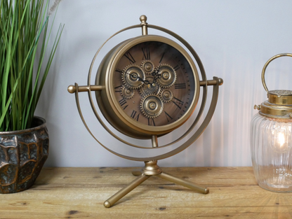 Gold mantle clock tripod legs with moving cog details