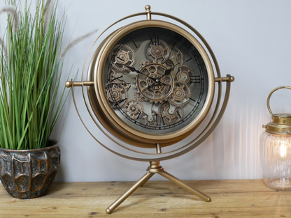Large gold clock moving cog detail and tri pod design