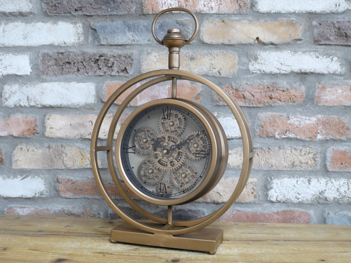 Round gold clock with moving cog detail