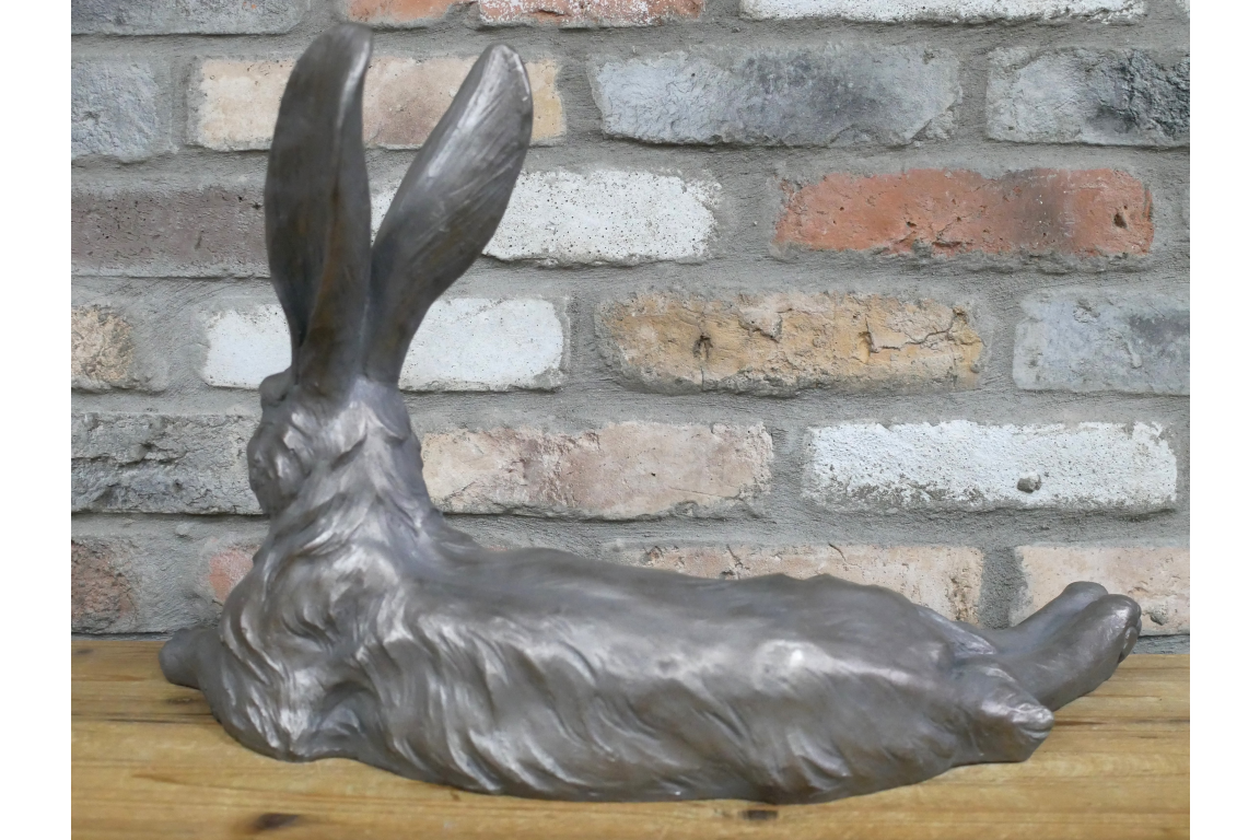Large laying down hare  in grey , indoor or outdoor statue