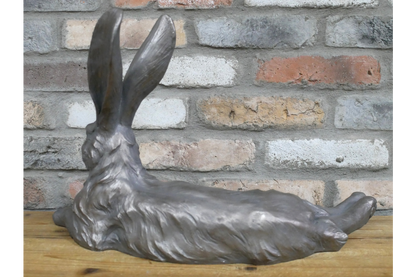 Large laying down hare  in grey , indoor or outdoor statue