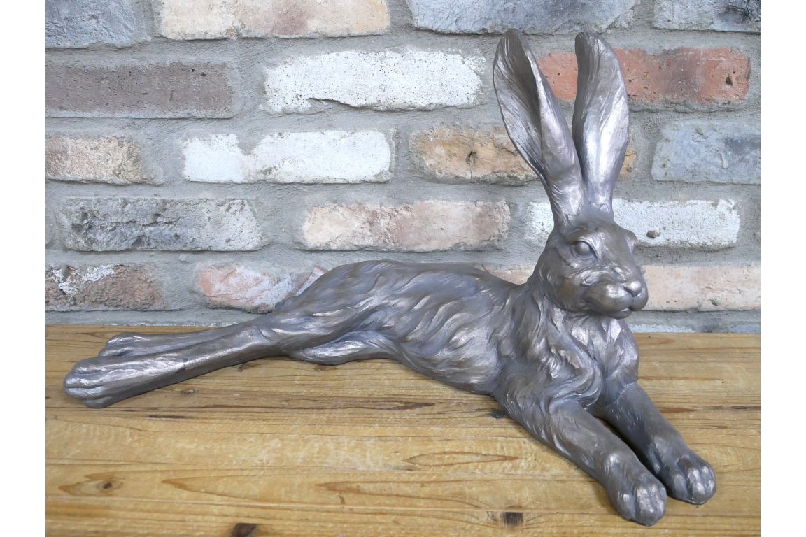 Large laying down hare  in grey , indoor or outdoor statue