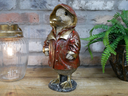 Duck in a red coat statue