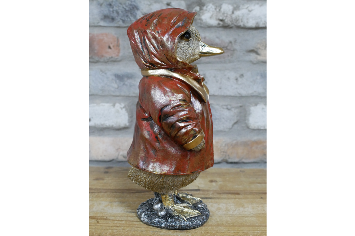 Duck in a red coat statue