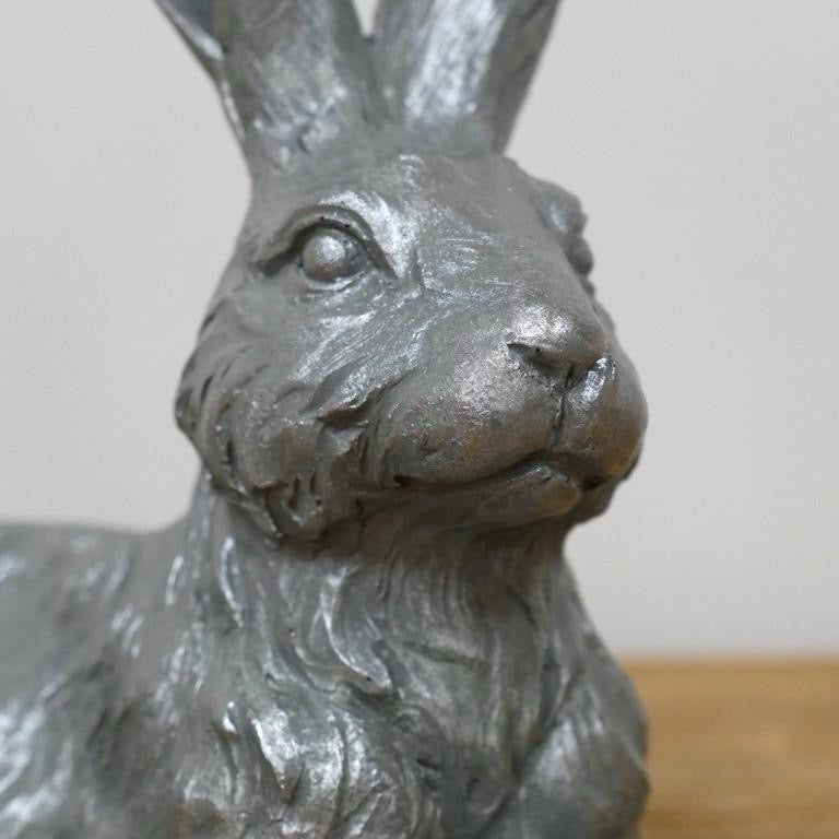 Small laying down hare for indoor or outdoor