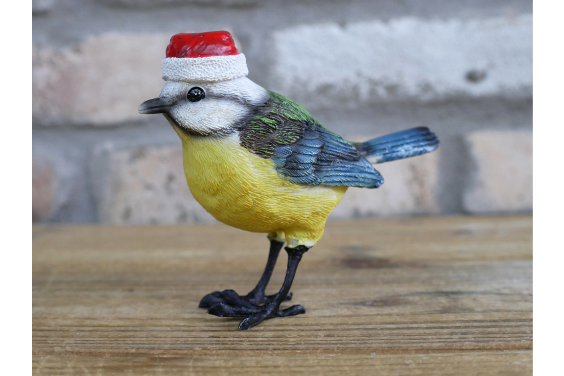 Christmas blue bird statue with Santa hat