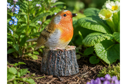 tweeting Robin on a log statue for the garden sensor activated