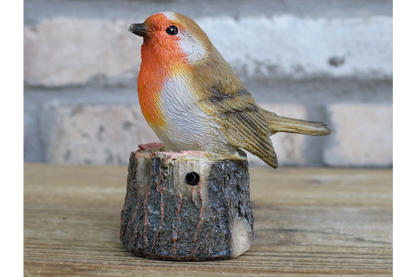 tweeting Robin on a log statue for the garden sensor activated
