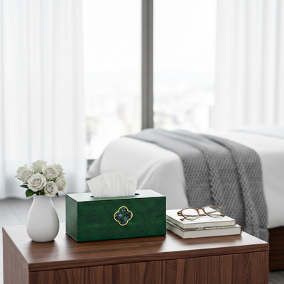 Green tissue box with green clasp detail. Faux leather