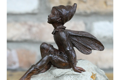 Light up fairy sitting on a stone Solar