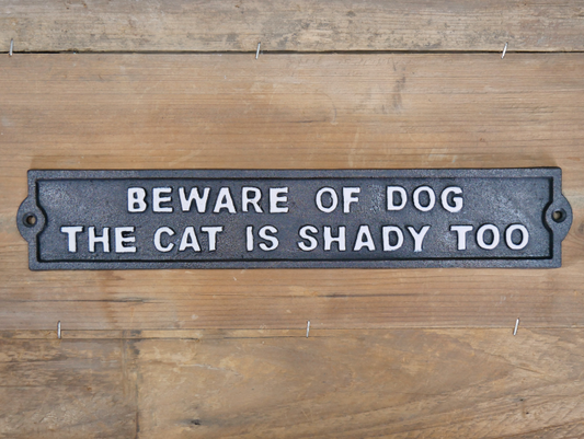 “Beware of the dog the cat is shady too” cast iron metal sign