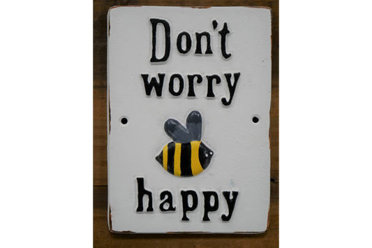 Cast iron sign “don’t worry be happy” on ndoor or out
