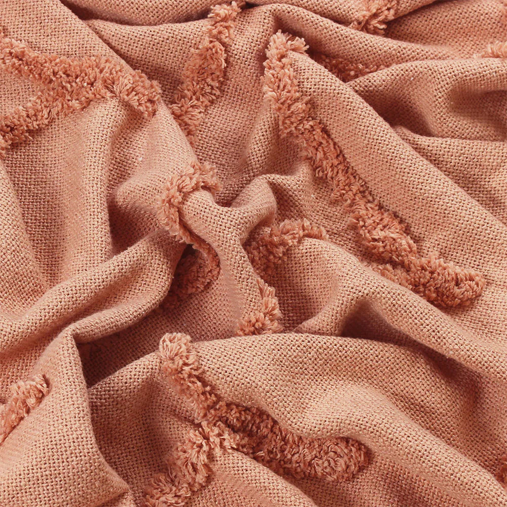 Textured throw in blush with Tassle detail