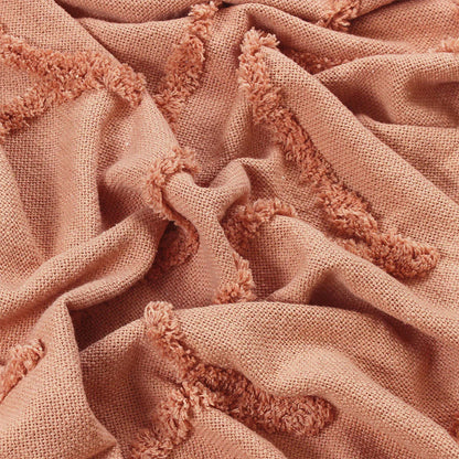 Textured throw in blush with Tassle detail