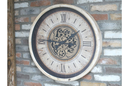 Large cream wall clock with moving brass cog detail