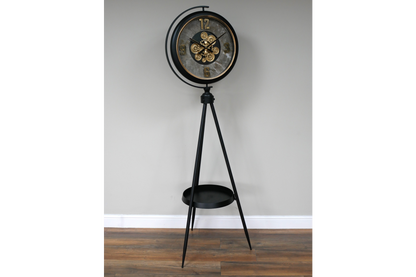 Black and gold industrial moving cog clock on a stand