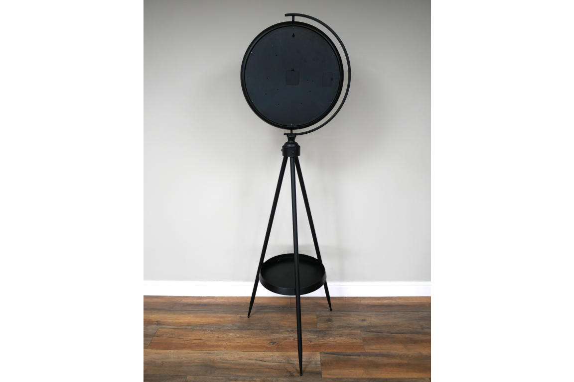 Black and gold industrial moving cog clock on a stand