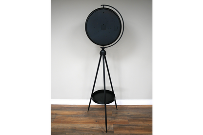 Black and gold industrial moving cog clock on a stand