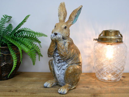 Rustic laughing rabbit statue for home or garden