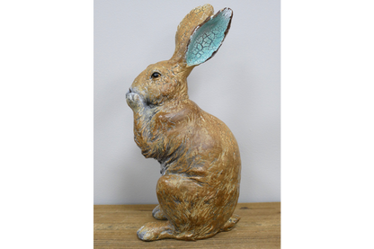 Rustic laughing rabbit statue for home or garden