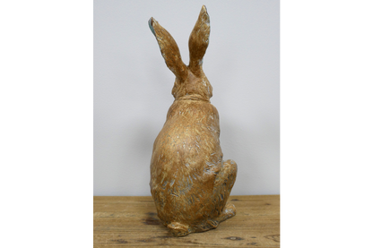 Rustic laughing rabbit statue for home or garden