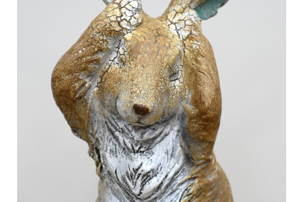 Rustic rabbit statue with hands over ears , for home or garden