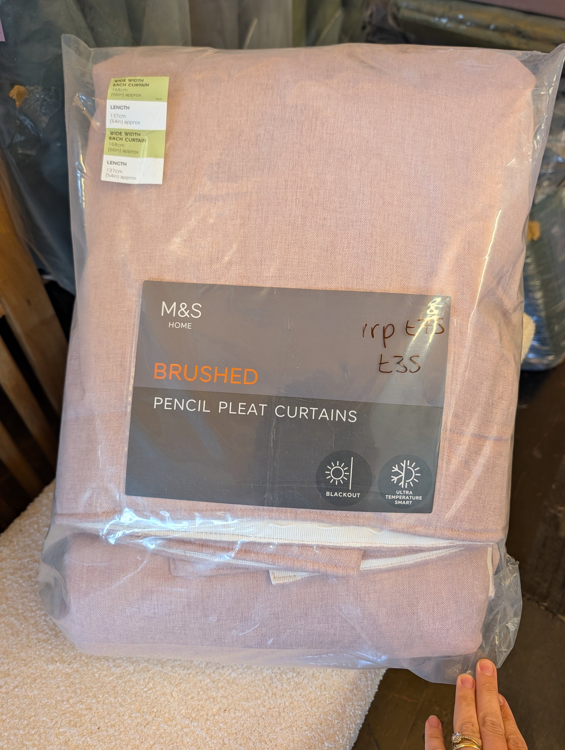 M&S Home Brushed Pencil Pleat Curtains in a dusty pink color, packaged in a clear plastic bag with a dark grey product label.